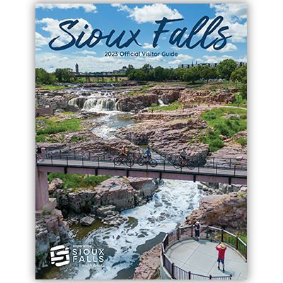 2023 Official Sioux Falls Visitor Guide publication cover showcasing the Falls of the Big Sioux River